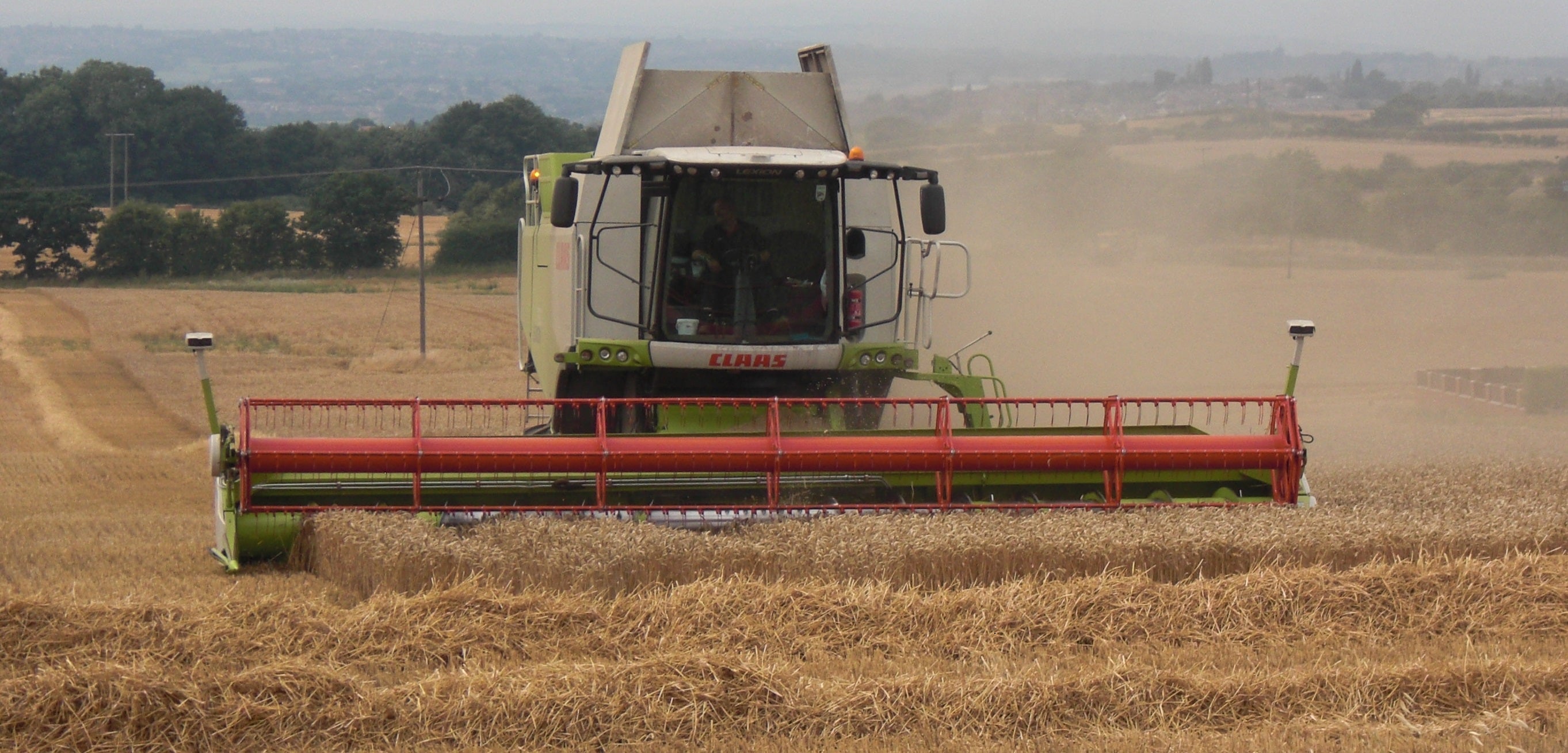 Combine harvester harvesting wheat in a field
